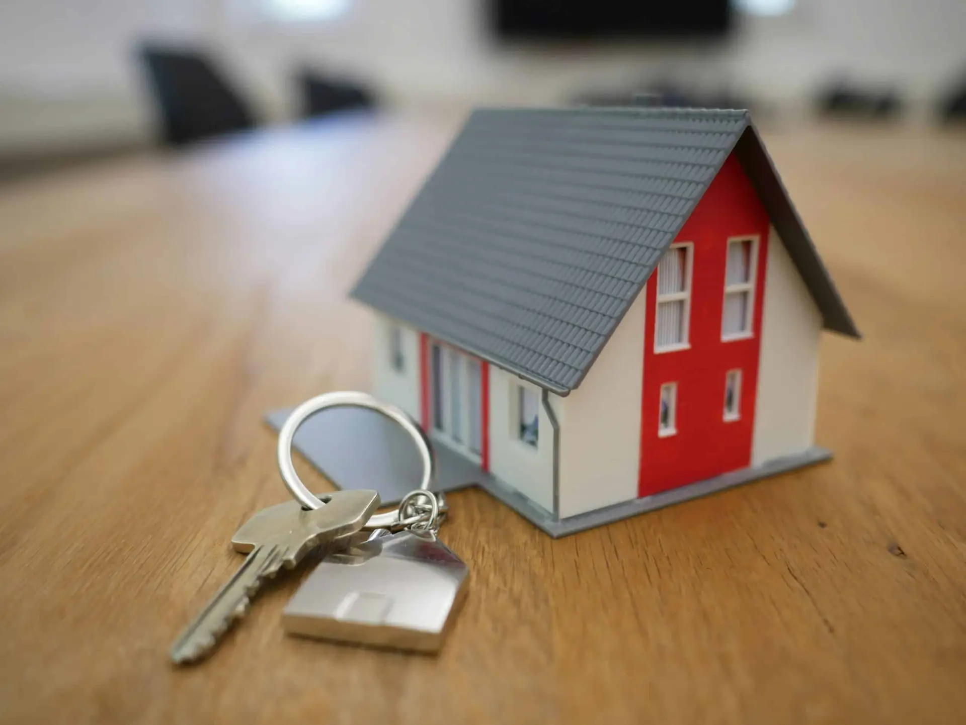 Model house with keys on table.