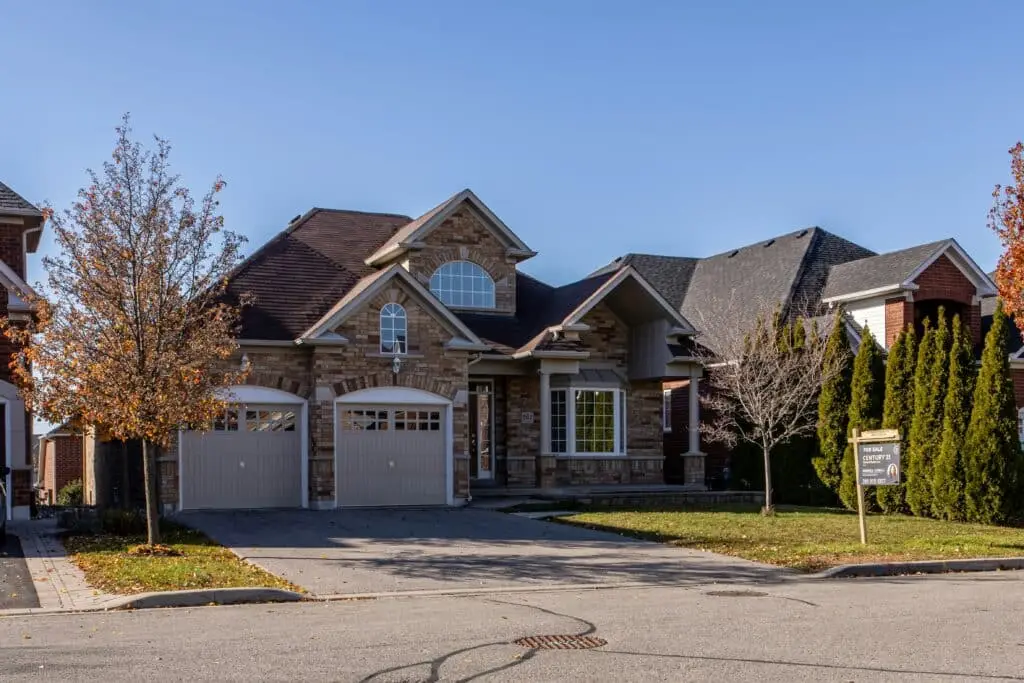 Elegant suburban house with autumn trees.